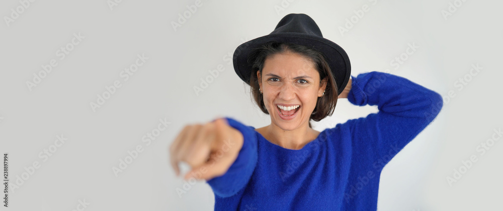 Isolated vibrant playful stunning brunette in hat looking at camera Isolated vibrant playful stunning brunette in hat looking at camera