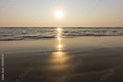 Sunset on Mandrem beach in Goa, India. photo