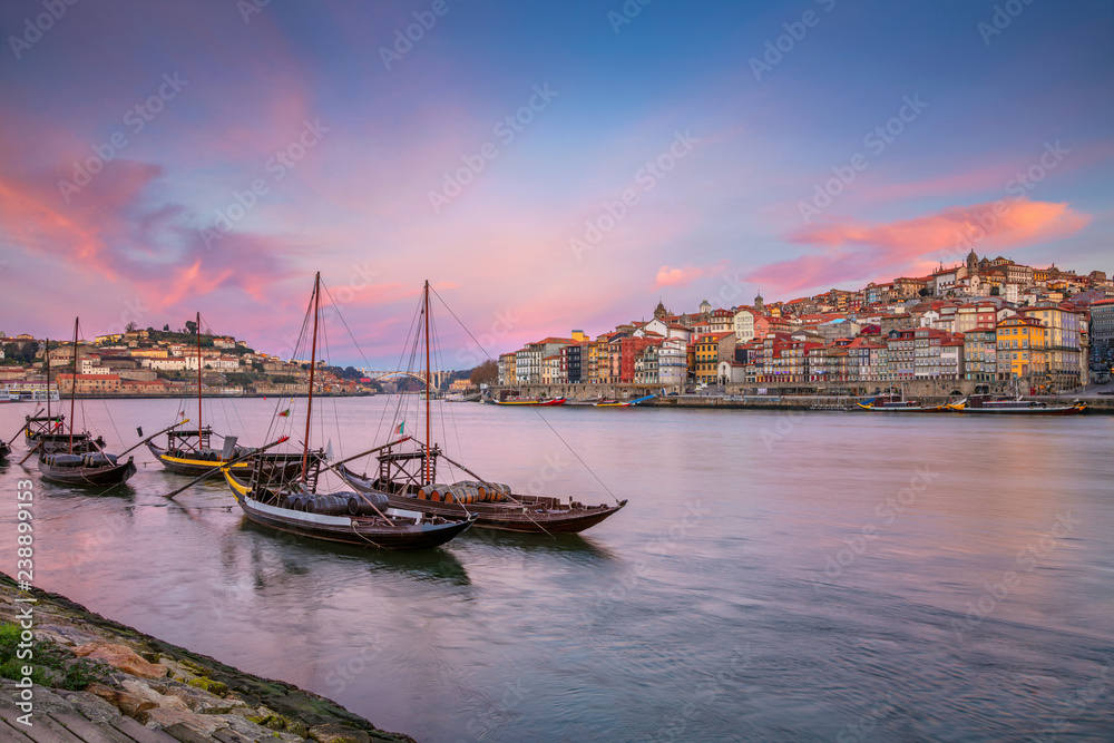 Porto, Portugal. Cityscape image of Porto, Portugal with reflection of the city in the Douro River during sunrise.