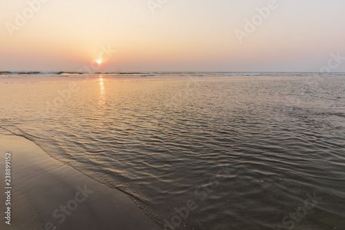 Sunset on Mandrem beach in Goa, India. photo