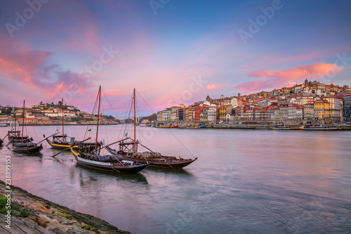 Obraz na płótnie Porto, Portugal. Cityscape image of Porto, Portugal with reflection of the city in the Douro River during sunrise. w salonie