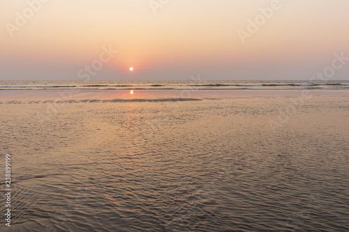 Sunset on Mandrem beach in Goa, India. photo