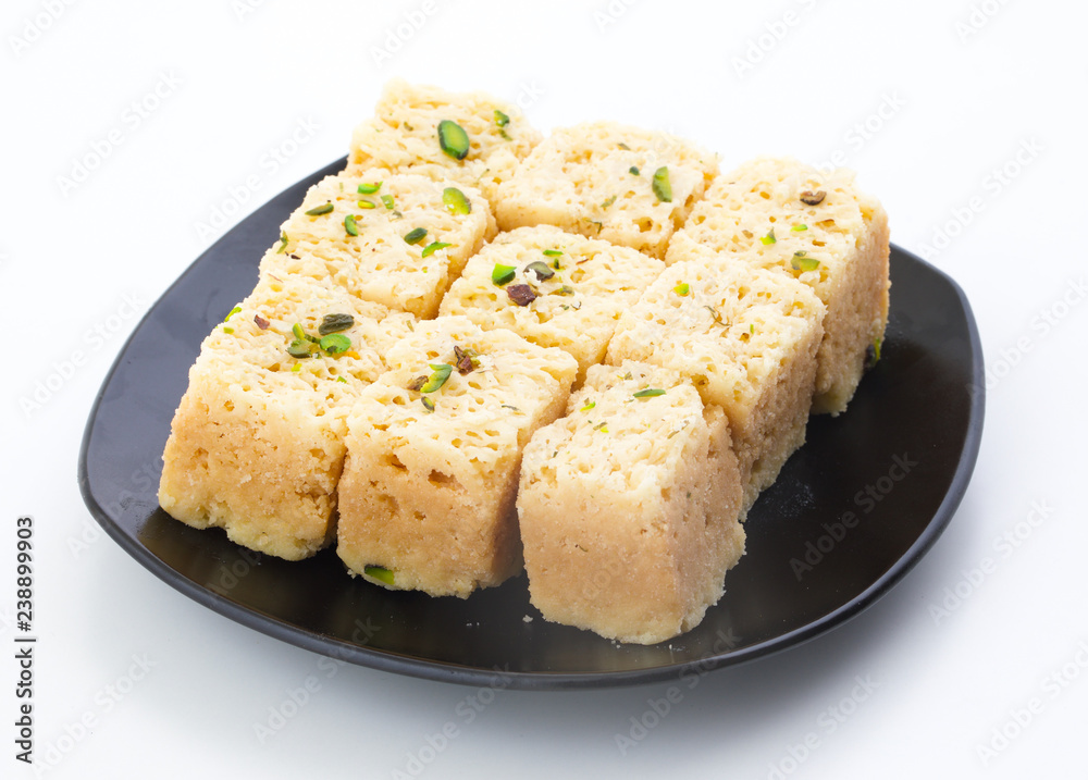 Indian Traditional Famous Sweet Food Mysore Pak or Mysoor Pak Isolated on White Background Indian Traditional Famous Sweet Food Mysore Pak or Mysoor Pak Isolated on White Background