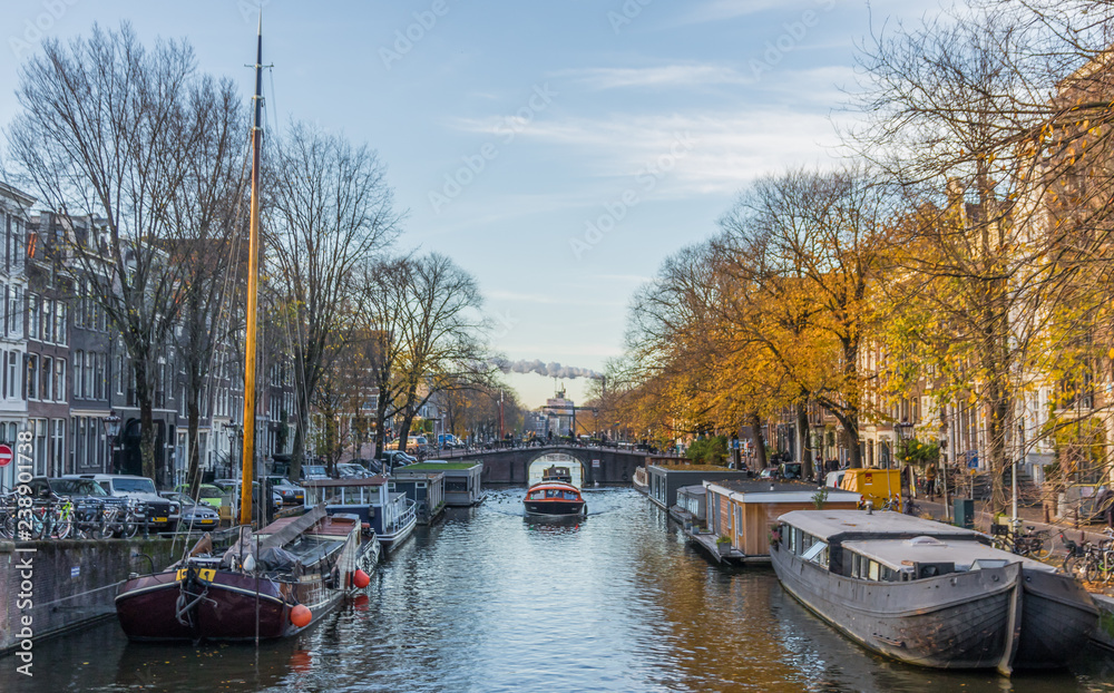Amsterdam, Netherlands - main city and capital of the country, Amsterdam offers a splendid display of history and modernity, surrounded by the unique view of its canals Amsterdam, Netherlands - main city and capital of the country, Amsterdam offers a splendid display of history and modernity, surrounded by the unique view of its canals