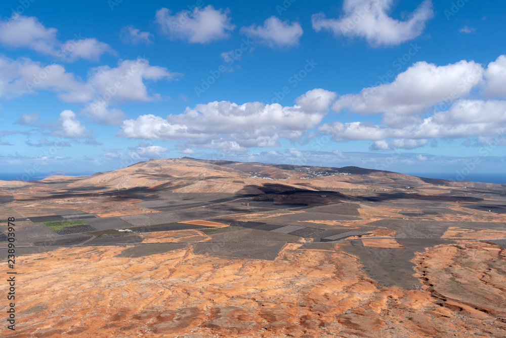 Lanzarote volcanic island in the Canary Islands, Spain. Panoramic elevated view Lanzarote volcanic island in the Canary Islands, Spain. Panoramic elevated view