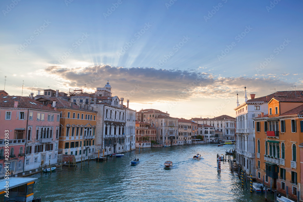 Boats on Grand Canal in Venice, Italy at sunset