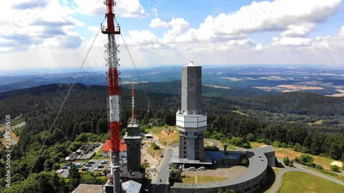 Aerial view and flight at Grosser Feldberg, aerial mast of hr and viewing tower, Oberreifenberg in the background, Hesse, Germany photo