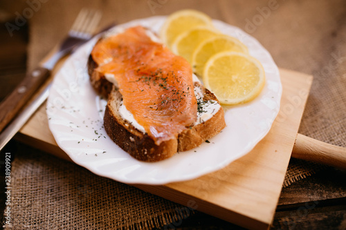 Smoked salmon with cheese toasted bread lemon and yogurt dip
