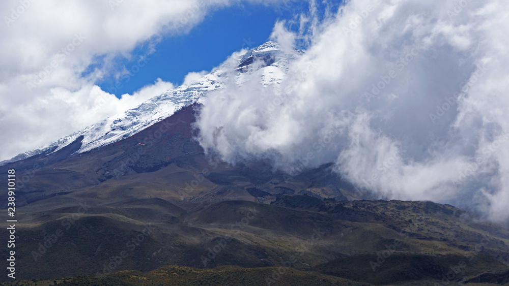 The Cotopaxi volcano behind clouds