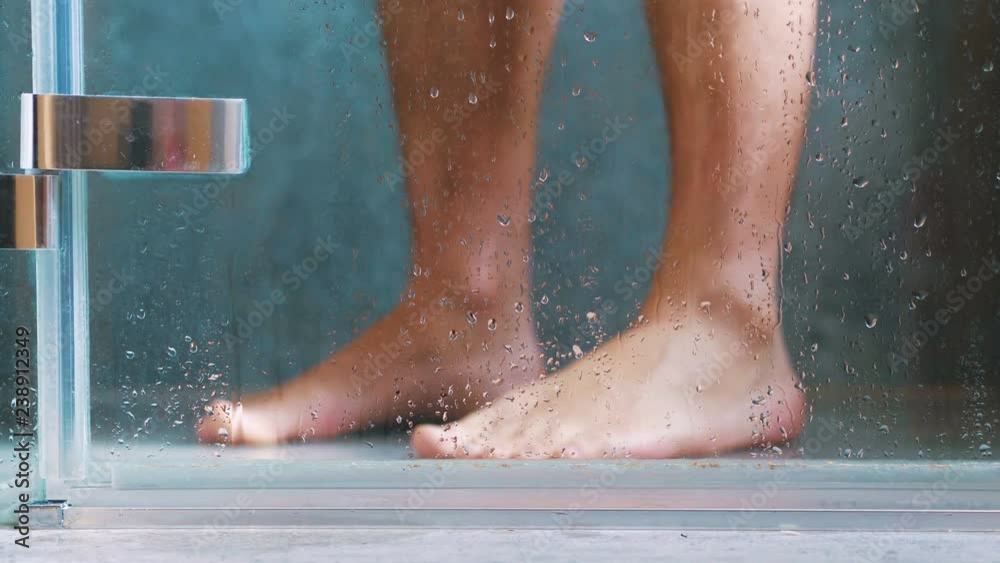 Man taking shower in 4k slow motion 60fps