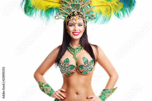 Brazilian woman posing in samba costume over white background