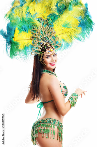 Brazilian woman posing in samba costume over white background photo