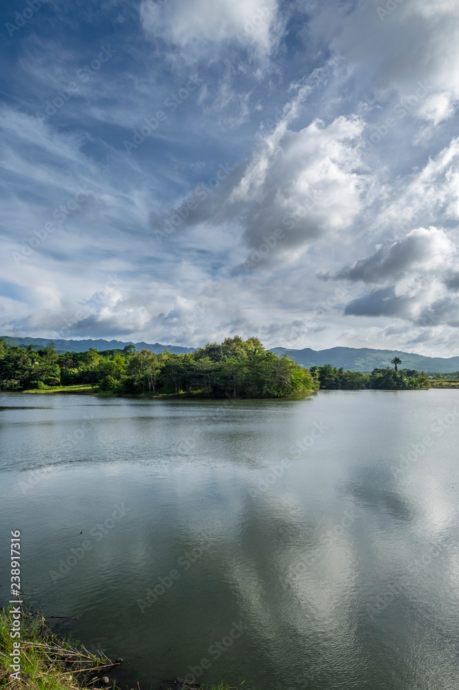 Pilar dam. Lake water, sun and clouds. Bohol