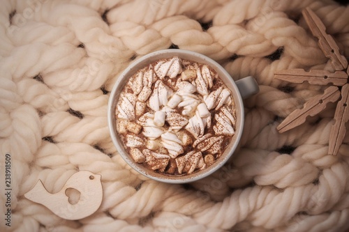 cup of coffee with marshmallow on a yarn