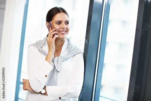 Close up portrait of attractive smiling businesswoman at workplace