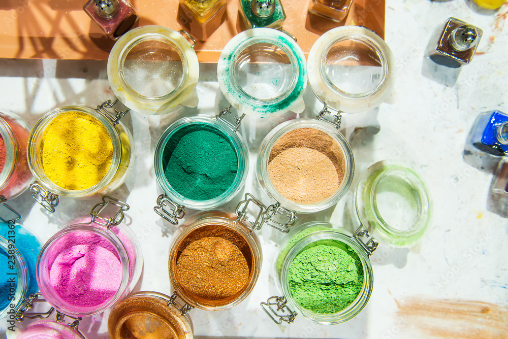 Tinsel. Shimmer. For makeup, manicure and decorating clothes. Beautiful bright background. Cosmetic, beauty products. Sparkles, confetti, glitter for decor. Multicolored eyeshadow Selective focus. Tinsel. Shimmer. For makeup, manicure and decorating clothes. Beautiful bright background. Cosmetic, beauty products. Sparkles, confetti, glitter for decor. Multicolored eyeshadow Selective focus.