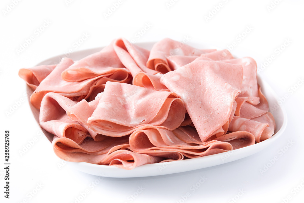 Mortadella slices on white plate isolated on white background. Close up