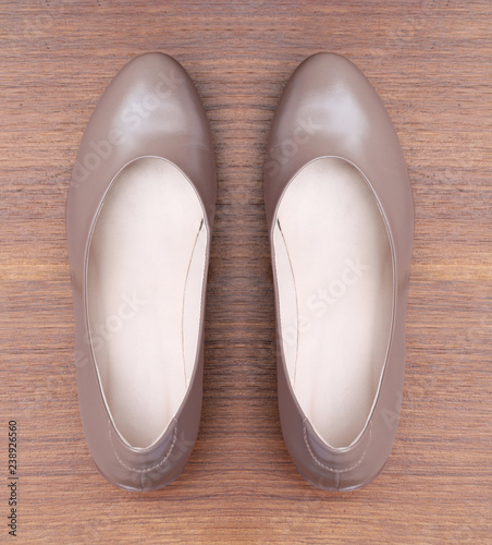 Brown shoes on wooden background