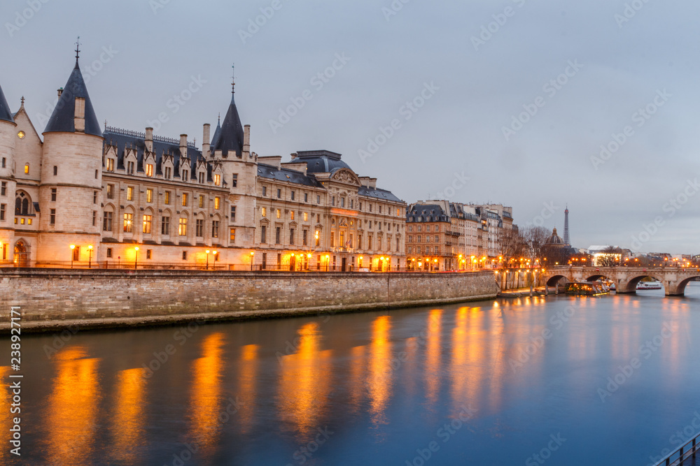 Morning view of the castle of the Conciergerie in Paris in the rain