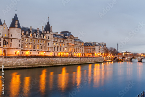 Morning view of the castle of the Conciergerie in Paris in the rain