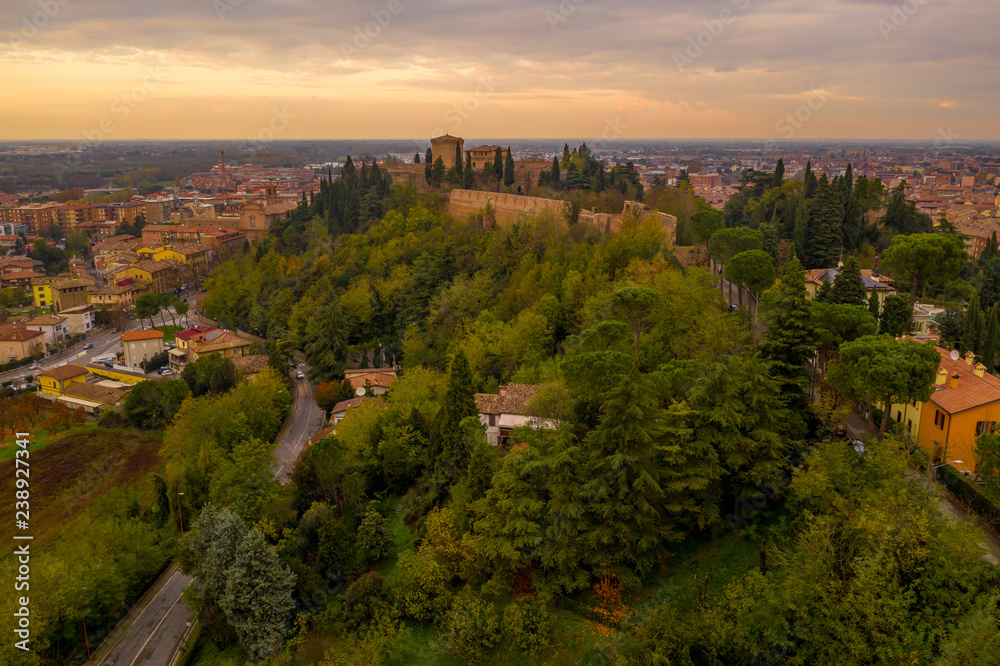 Sunset aerial panorama of Cesena in Emilia Romagna Italy near Forli and Rimini, with the medieval Malatestiana castle, Piazza del Popolo and Roman Catholic churches and cathedral on a winter afternoon