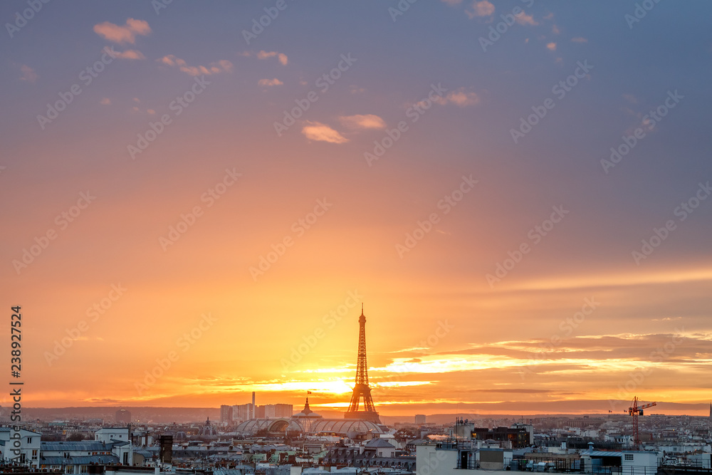 aerial view from the heights on paris and the eiffel tower at sunset