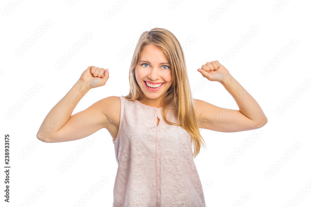 Portrait of a young beautiful blonde who expresses emotions of victory and satisfaction having raised her arms up half-bent and smiling, fashion shooting, woman's emotions, shooting on an isolated Portrait of a young beautiful blonde who expresses emotions of victory and satisfaction having raised her arms up half-bent and smiling, fashion shooting, woman's emotions, shooting on an isolated