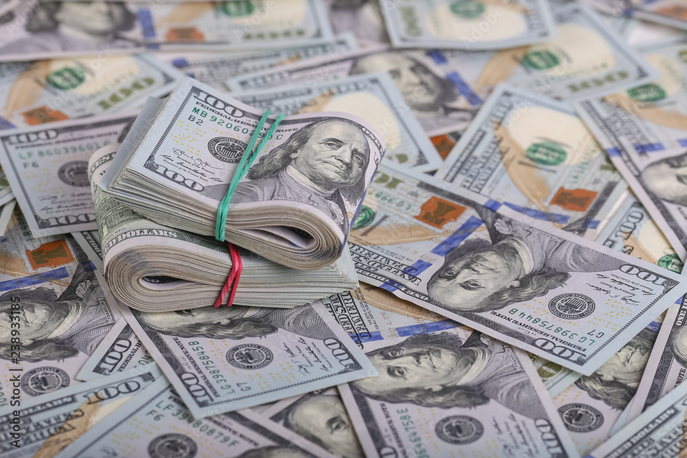 American dollars in one hundred banknotes. Lot of dollars close up American dollars in one hundred banknotes. Lot of dollars close up