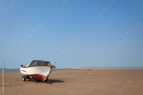 boats rest on the sand at Instow beach, devon