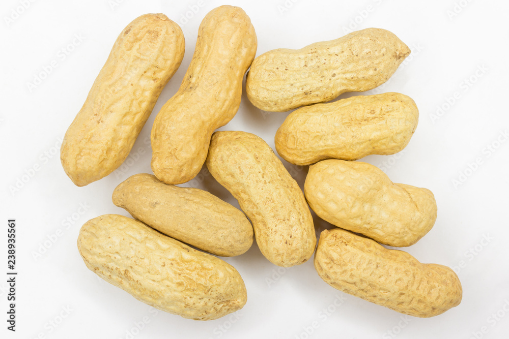 unpeeled peanuts on white background unpeeled peanuts on white background