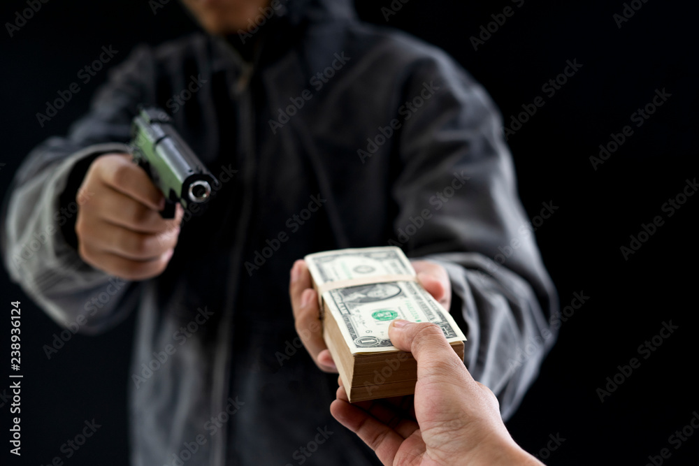 custom made wallpaper toronto digitalRobbery with gun's. Gun and money in a hands. Bank robbery, Man carrying a gun to rob the bank note. To threaten with the man. A murderer attacking holding gun kidnapping business young person.