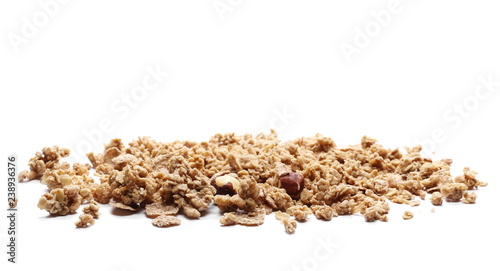 Crunchy granola, muesli pile with nuts isolated on white background