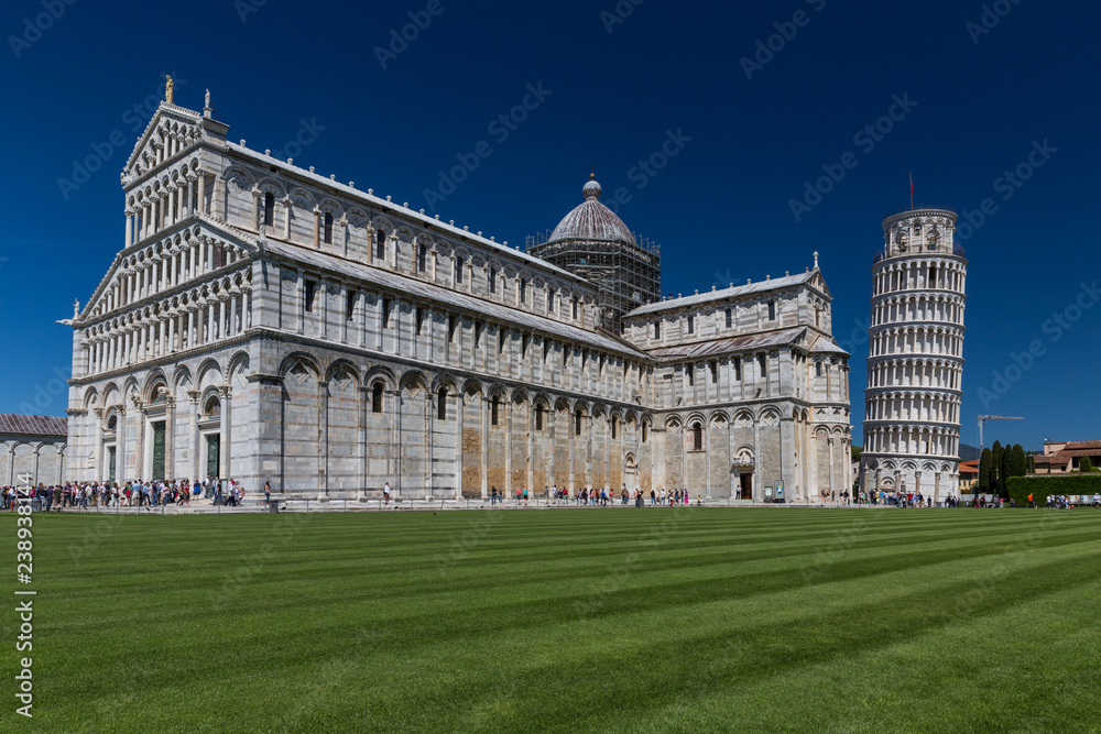 Crowds of tourists visiting the Leaning Tower of Pisa, Tuscany, Italy (motion blur technique used to convey the incessant influx of tourist to this landmark)