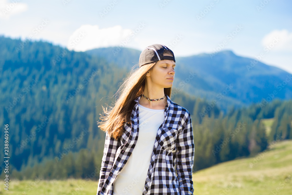 Serenity young tourist woman on top of mountains contemplating view and enjoy freedom