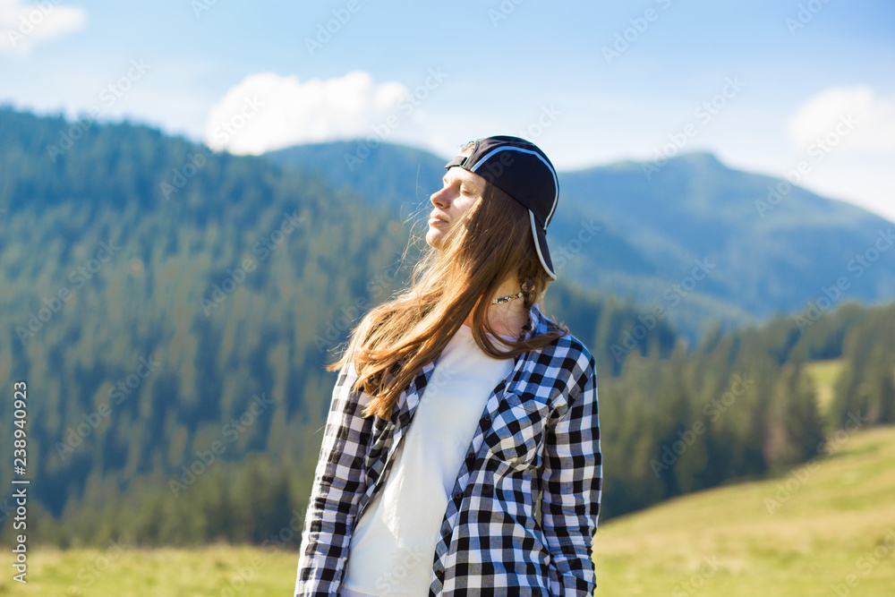 Serenity young tourist woman on top of mountains contemplating view and enjoy freedom