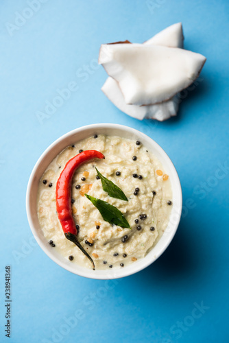 Nariyal or Coconut Chutney served in a bowl. Isolated over moody background. selective focus