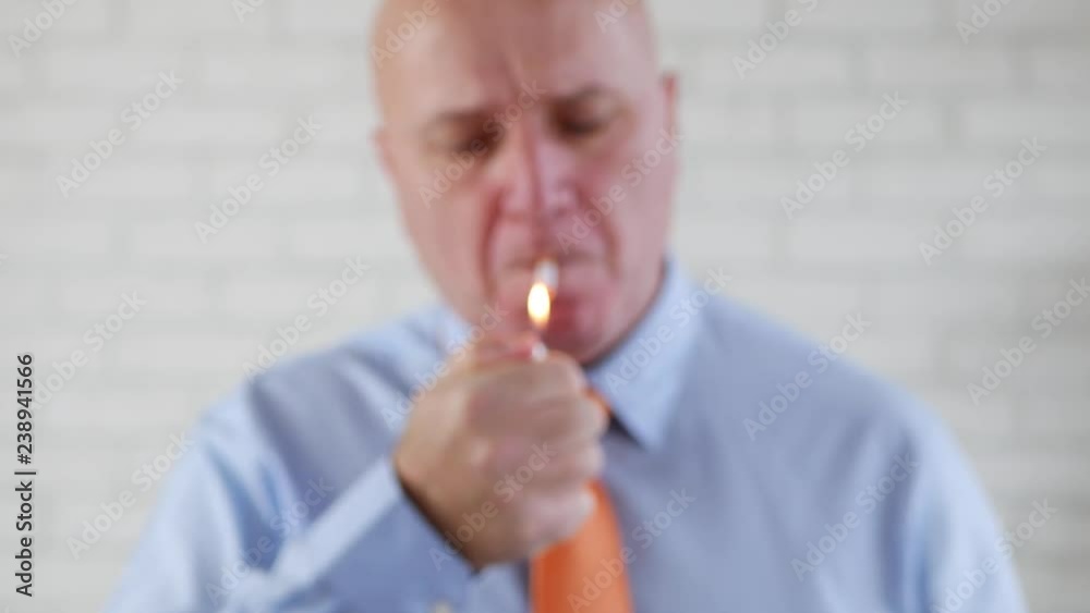 Businessman in Office Room Lighting a Cigarette and Offering to Another Person Businessman in Office Room Lighting a Cigarette and Offering to Another Person