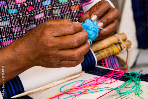 Mayan Woman Weaving on Belt Loom in Chiapas, Mexico photo