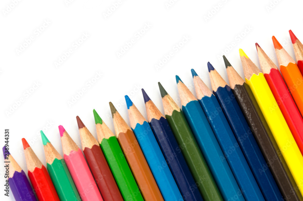 Color pencils pink light blue green yellow and red on white background. Color pencils pink light blue green yellow and red on white background.