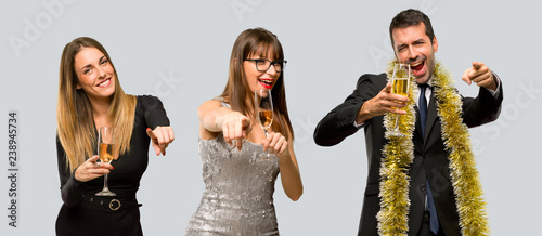 Photography Group of people with champagne celebrating new year 2019 points finger at you wh
