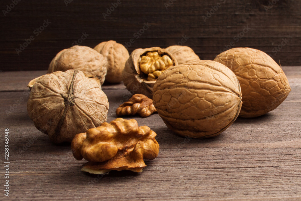 Handful of Walnuts on wooden background