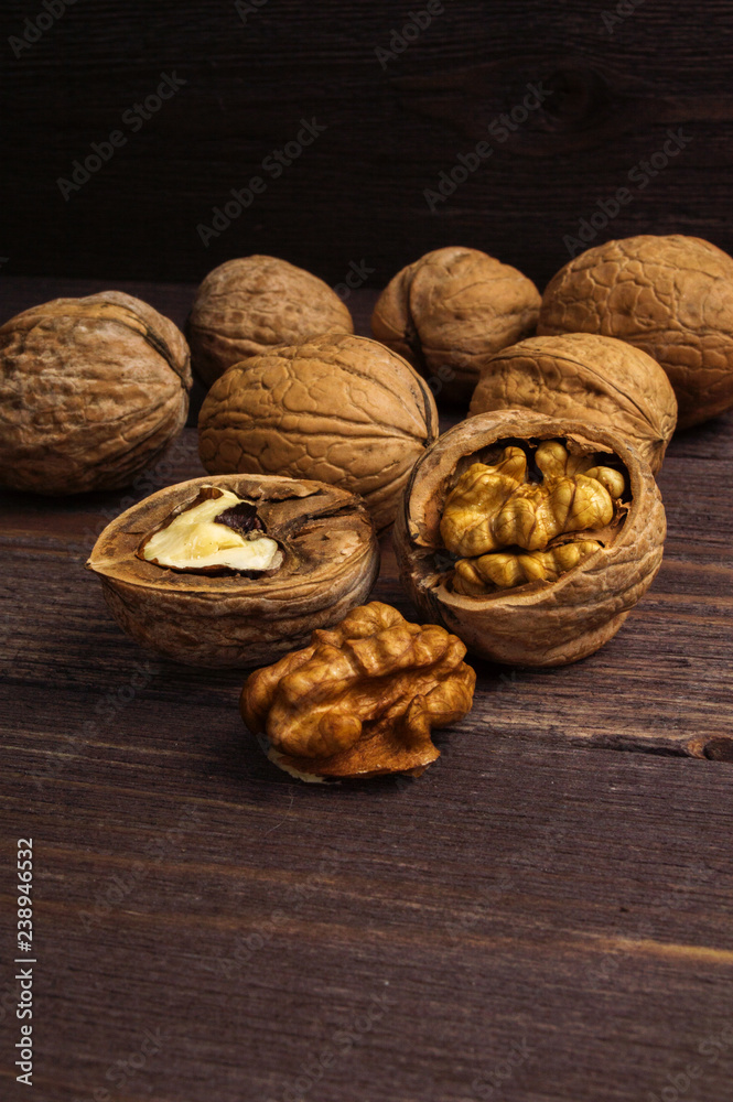 Handful of Walnuts on wooden background Handful of Walnuts on wooden background