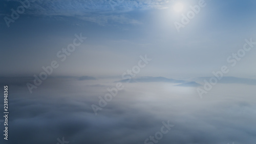 Aerial view from a drone about the Transylvanian valleys on a foggy morning  above Sic village  Transylvania   Romania