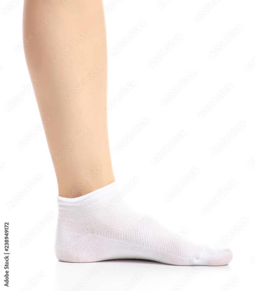 Female legs in white socks on white background. Isolation Female legs in white socks on white background. Isolation