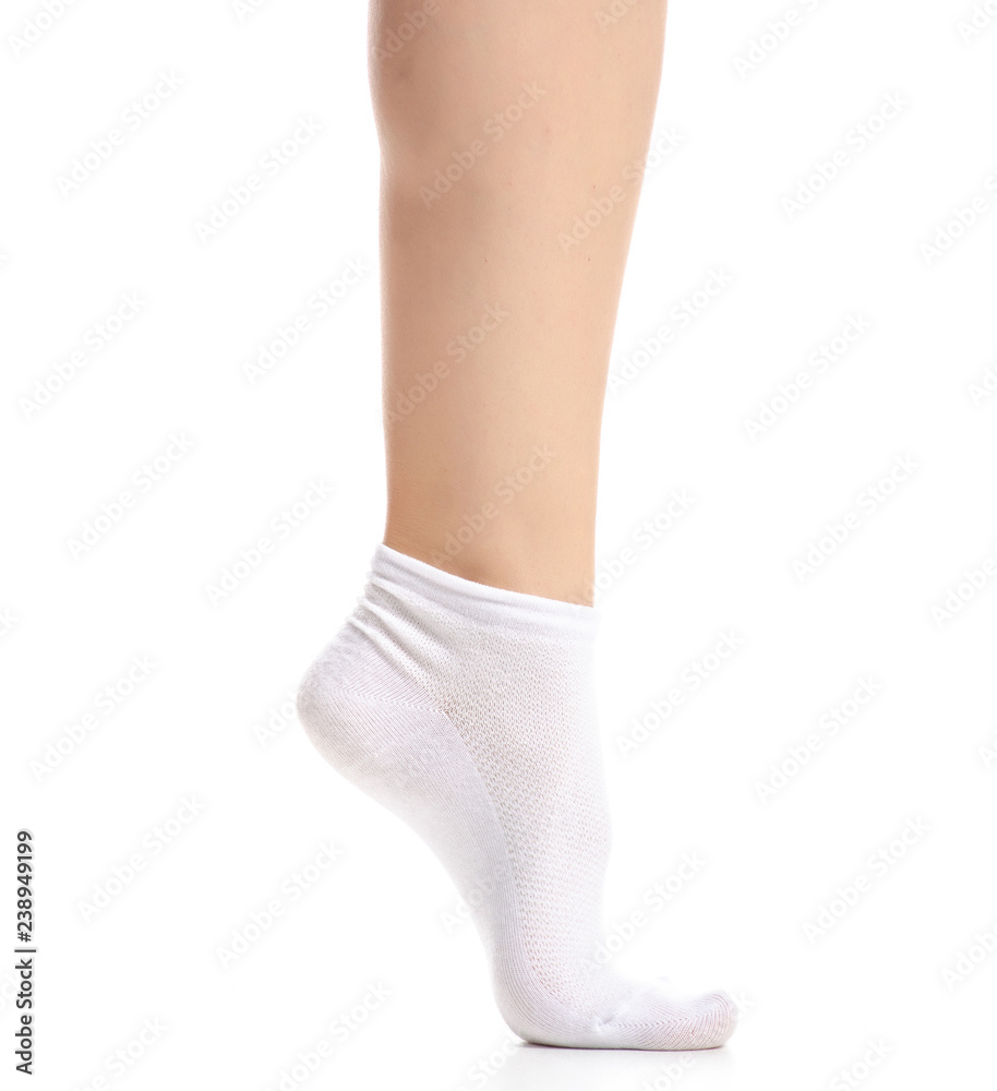 Female legs in white socks on white background. Isolation Female legs in white socks on white background. Isolation