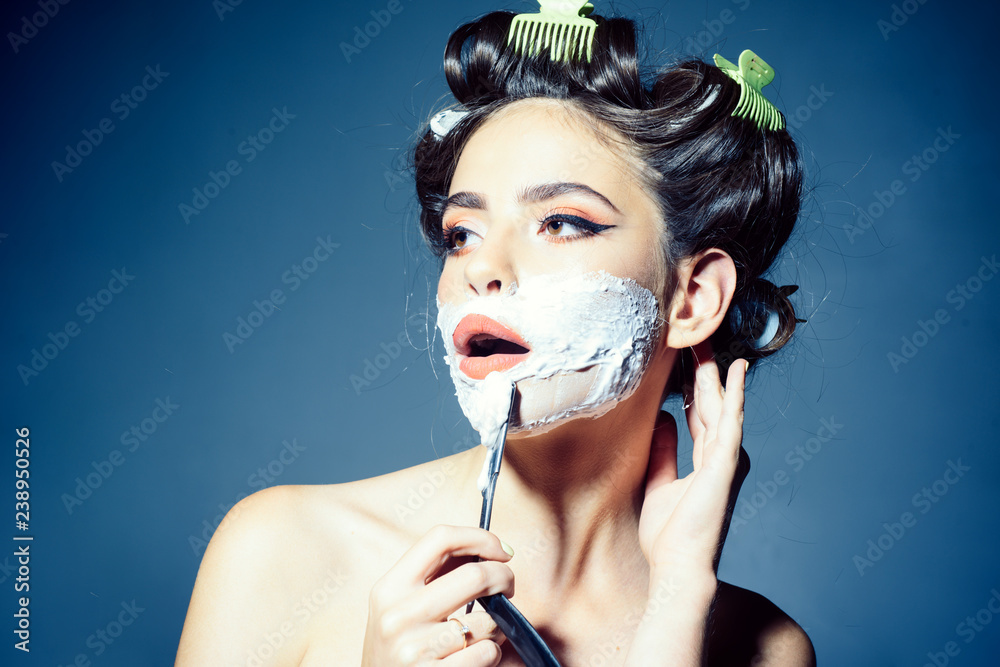 pretty girl in vintage style. woman shaving with foam and razor