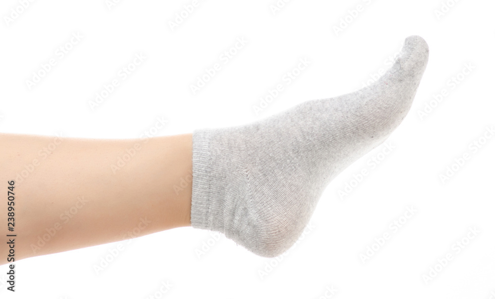 Female legs in gray socks on white background. Isolation Female legs in gray socks on white background. Isolation