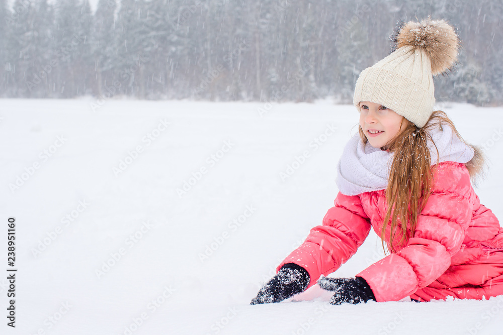 Portrait of little adorable girl in snow sunny winter day Portrait of little adorable girl in snow sunny winter day