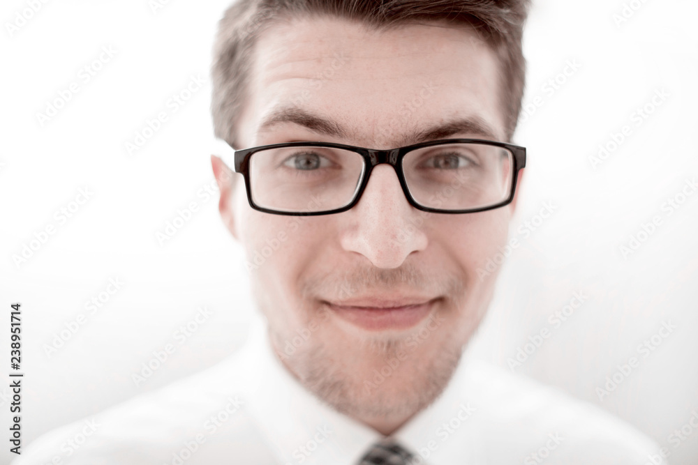 portrait of a successful young businessman with glasses