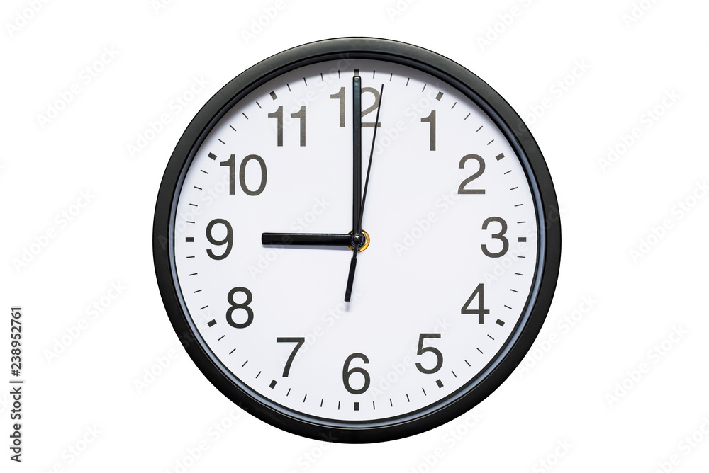Wall clock shows time 9 o'clock on white isolated background. Round wall clock - front view. Twenty one o'clock Wall clock shows time 9 o'clock on white isolated background. Round wall clock - front view. Twenty one o'clock